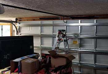 Detailed view of balanced springs and door rails after replacement on Glendale AZ garage
