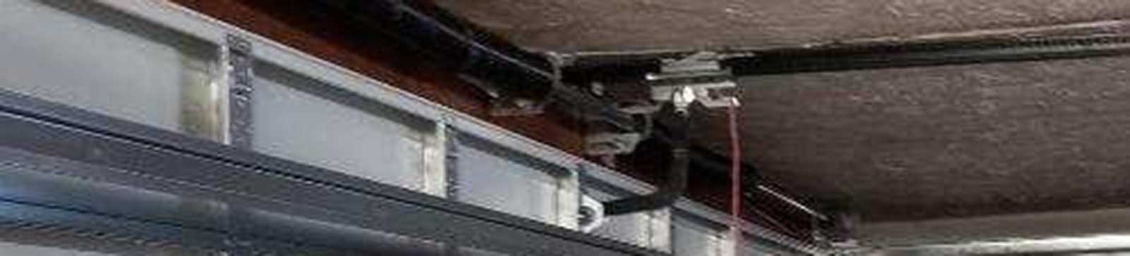 Detailed view of balanced springs and door rails after replacement on Glendale AZ garage
