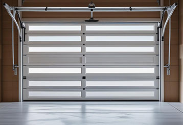 Brand new residential garage door in Goodyear, AZ being inspected and maintained by a technician