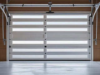 Brand new residential garage door in Goodyear, AZ being inspected and maintained by a technician